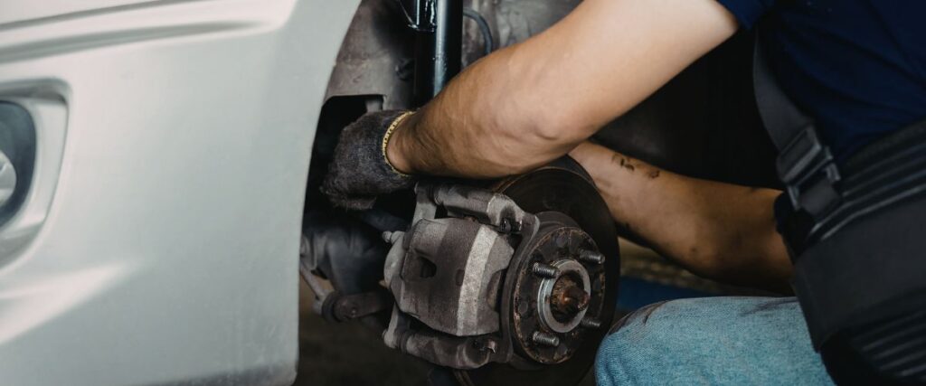 mechanic replacing brake rotors and pads